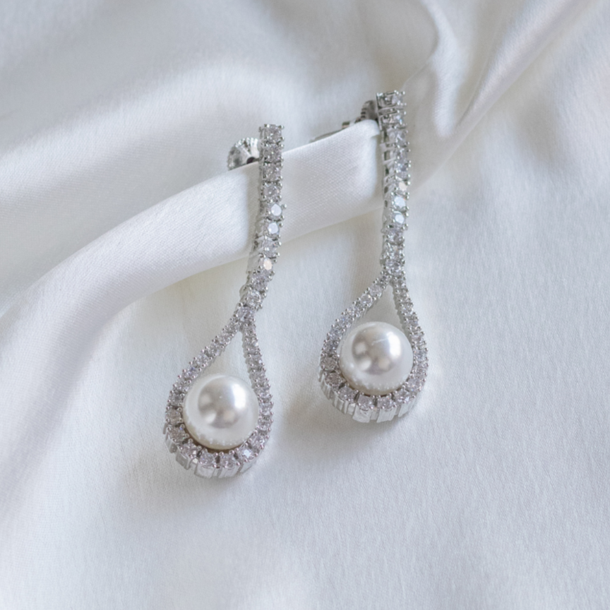 White rodium finish zircon dangler earrings