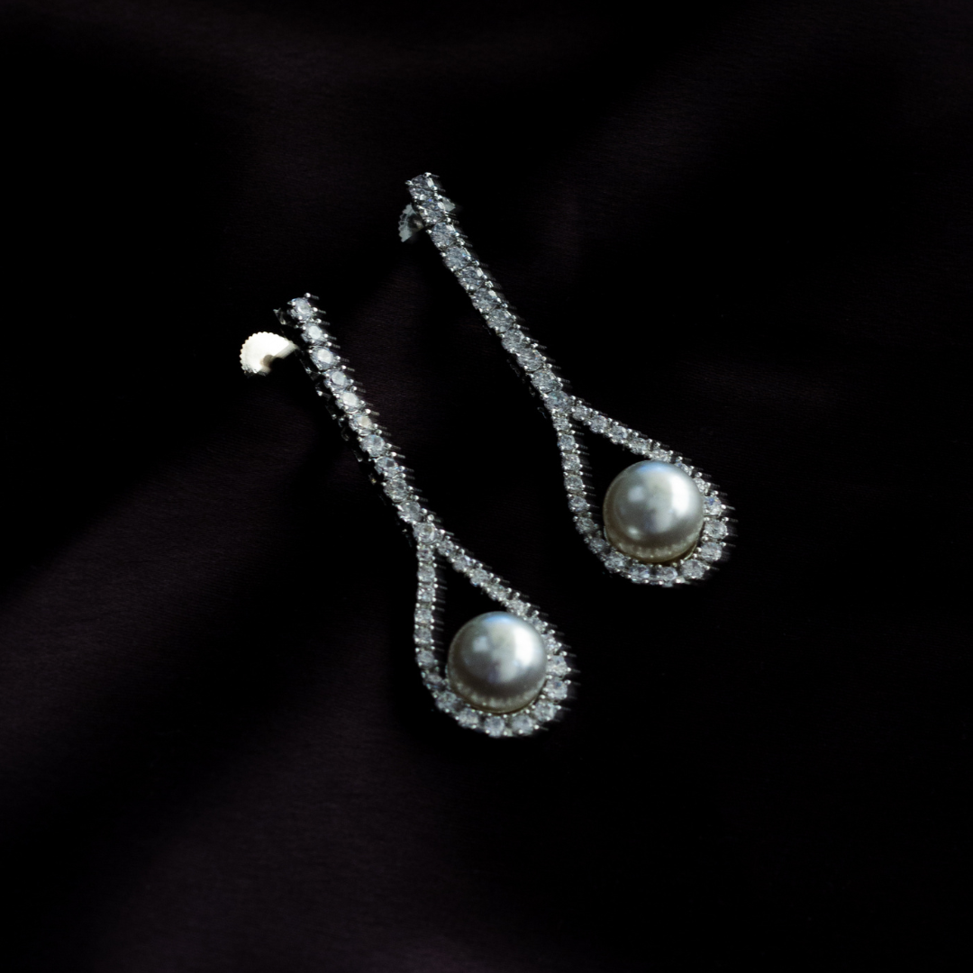 White rodium finish zircon dangler earrings