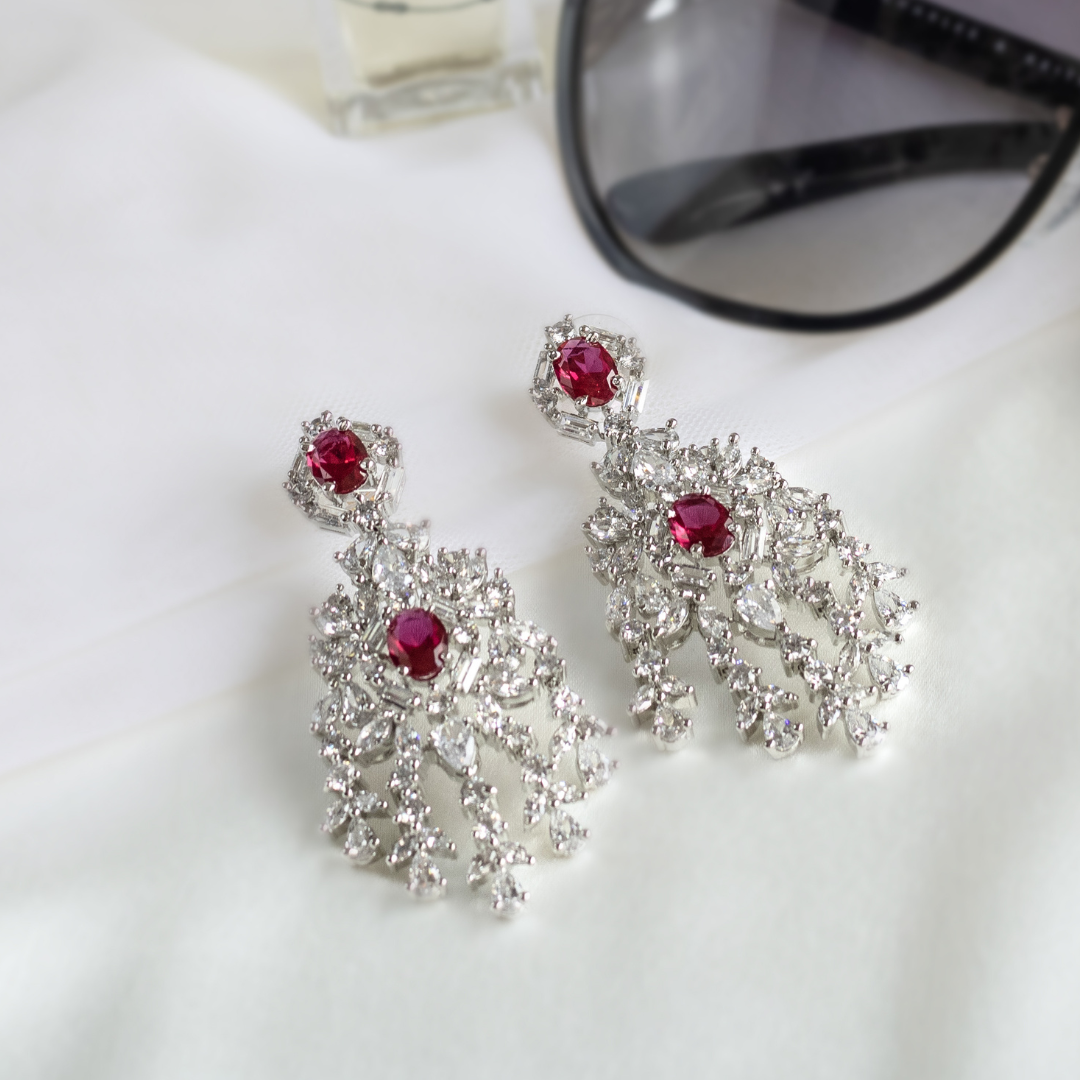 White Finish Faux Diamond & Red Stone Dangler Earrings