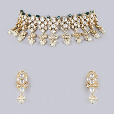 Choker crafted with polki and kundan embellishments with matching  earrings